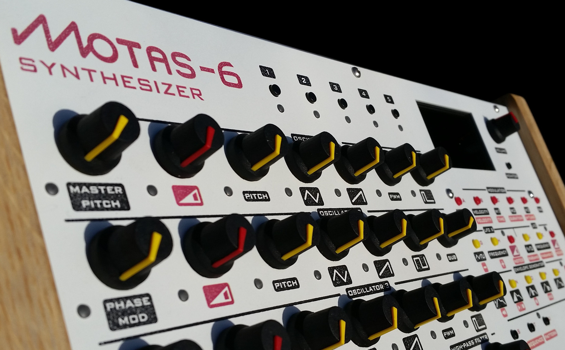 motas-6 synth with white panel finish
